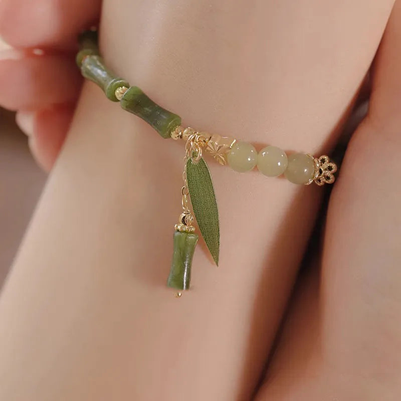 Chinese style glass bracelet with bamboo joint element in multiple colour variations