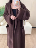 Women's loose hooded cardigan coat in acrylic fibre with 80cm length and raglan sleeves
