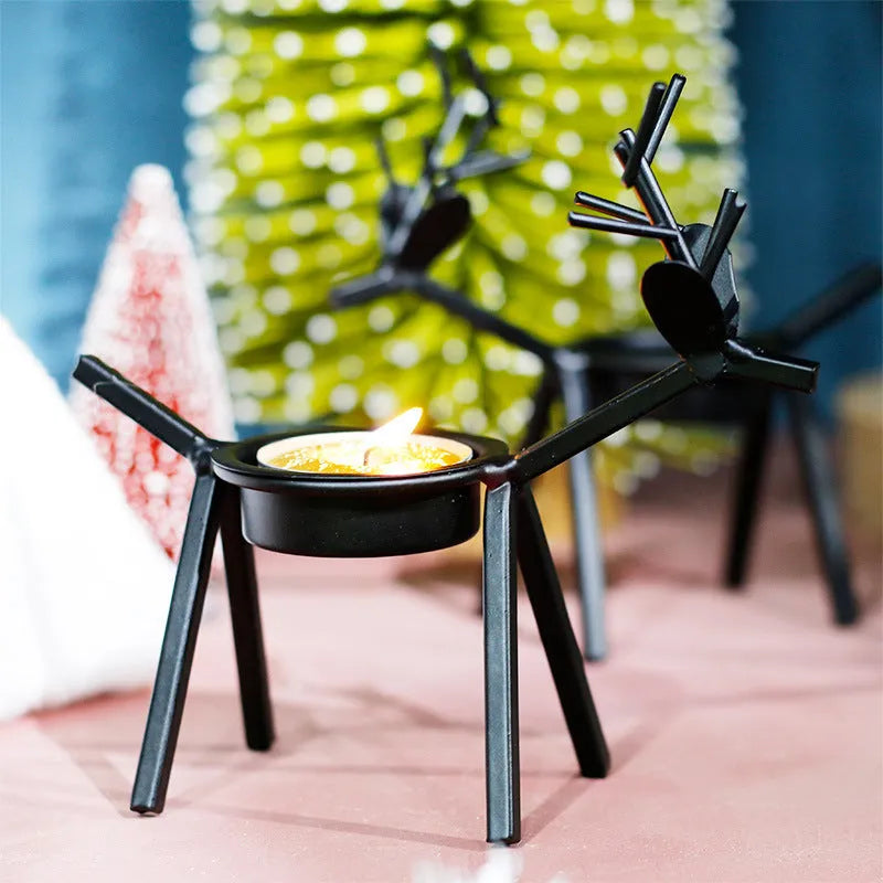 Black iron Christmas candlestick with deer or elk design for candle holding