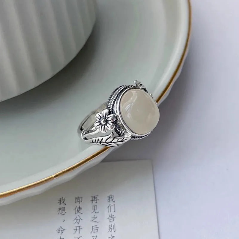 Adjustable copper vintage ring with white chalcedony stone and open mouth design