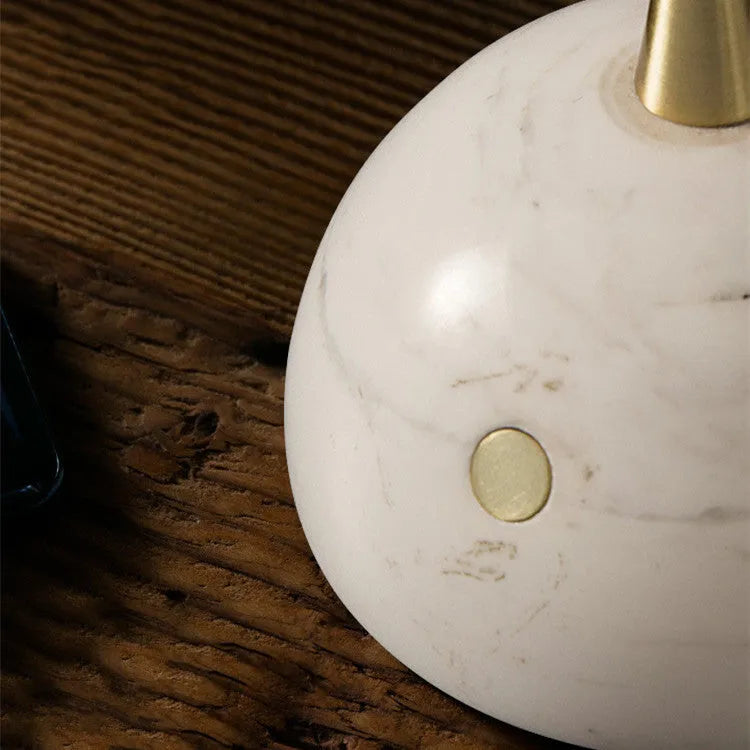 Clear glass dimmable desk lamp with touch switch on a wooden desk.