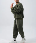 Men's black polar fleece sports suit with long sleeve crew neck coat and loose fit trousers.