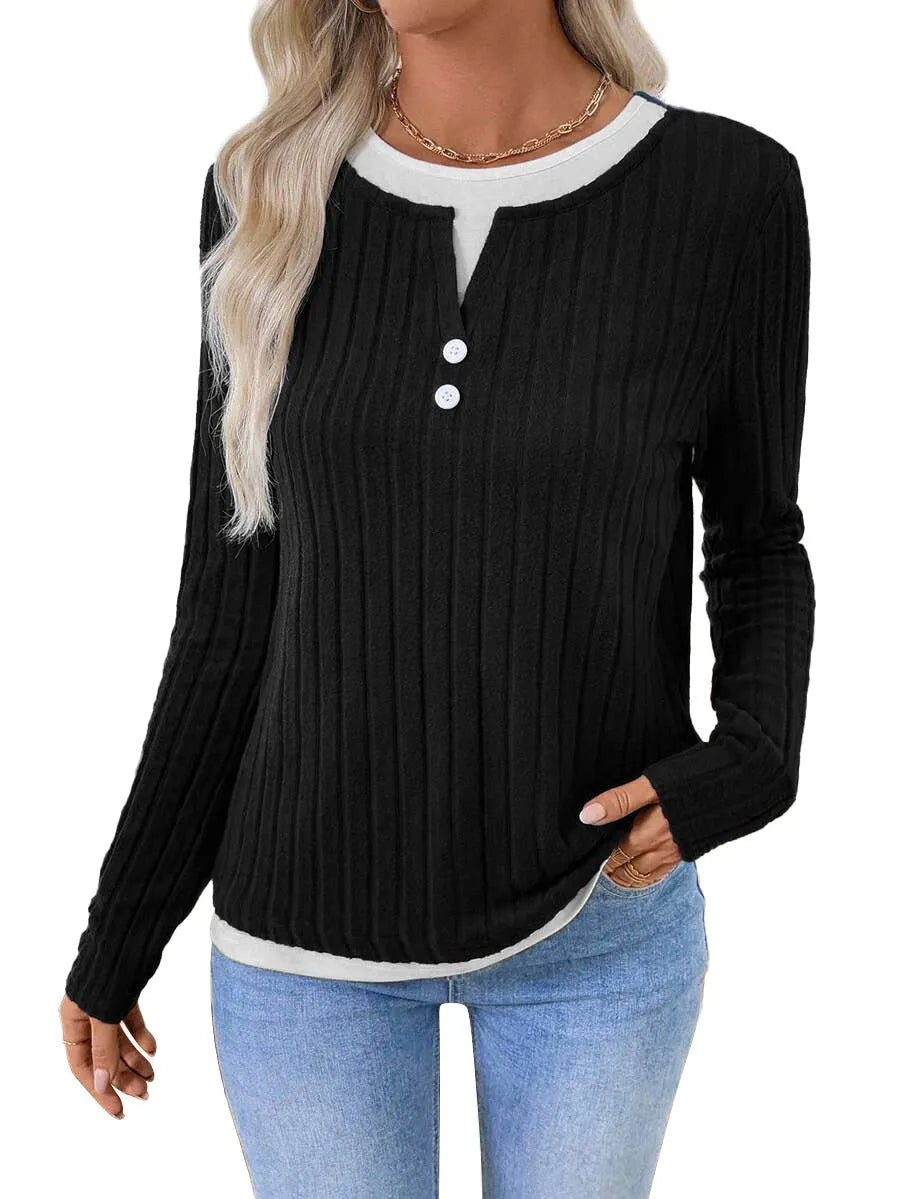 Women's black fake two-piece pullover sweater with button front and round neck on a model.