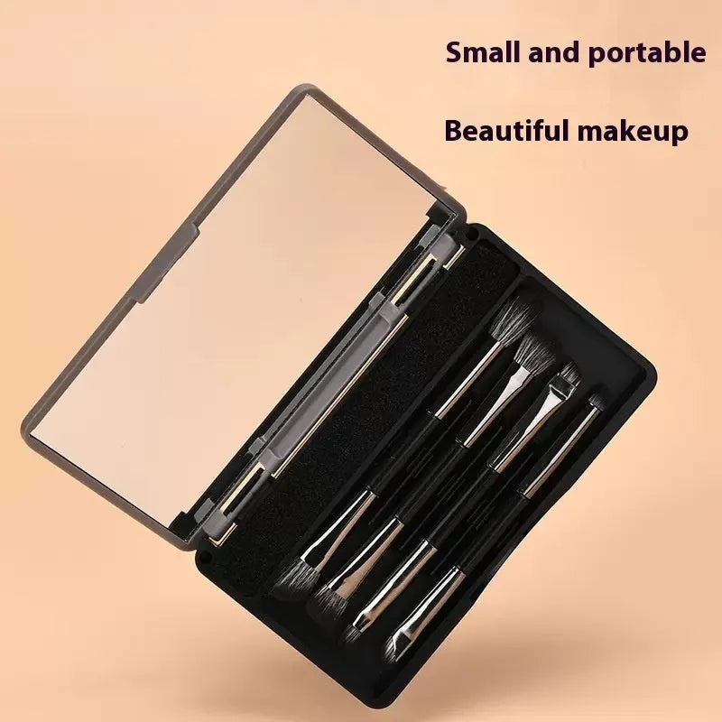 Makeup brush set with mirror showing artificial fibre bristles and plastic handles in portable packaging