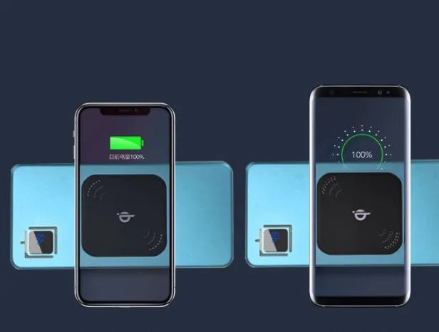 Silver portable power bank with LCD display showing battery percentage, placed next to a mobile phone.