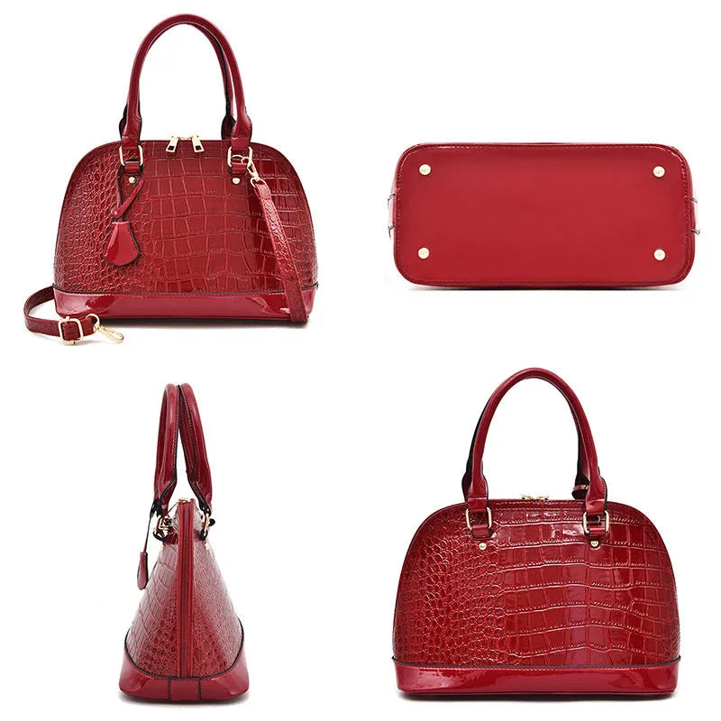 Large shiny PU leather crossbody shoulder bag in shell shape, showing black, red, and brown colour options