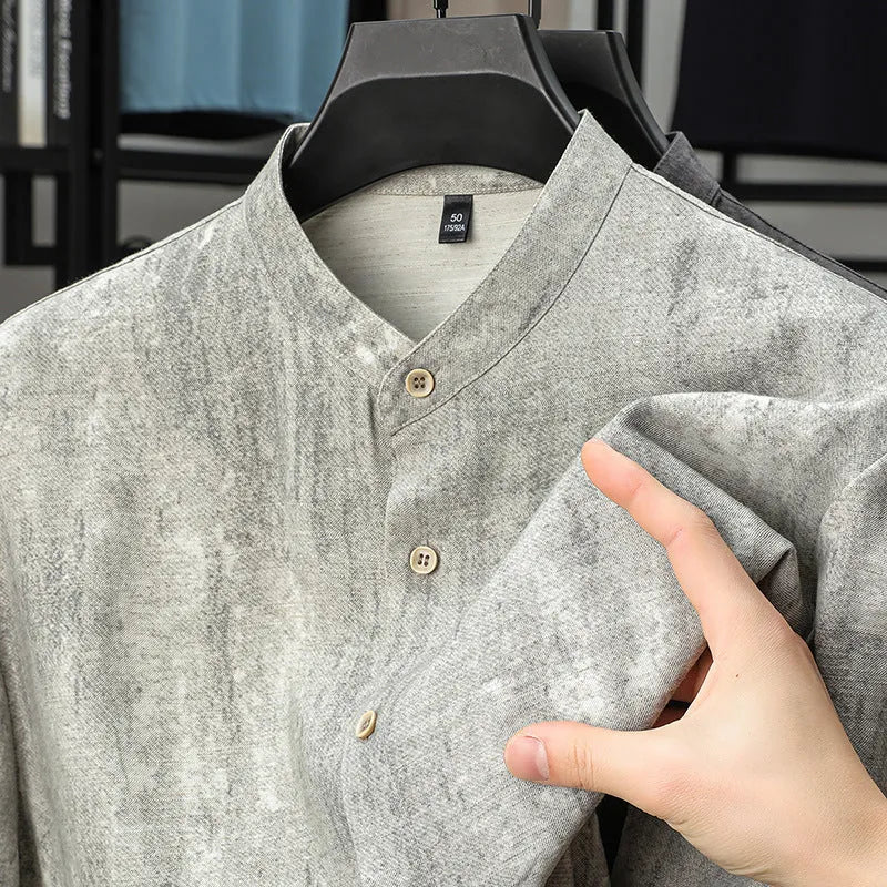Men's loose fit linen shirt in solid colour with stand collar, shown in black grey.