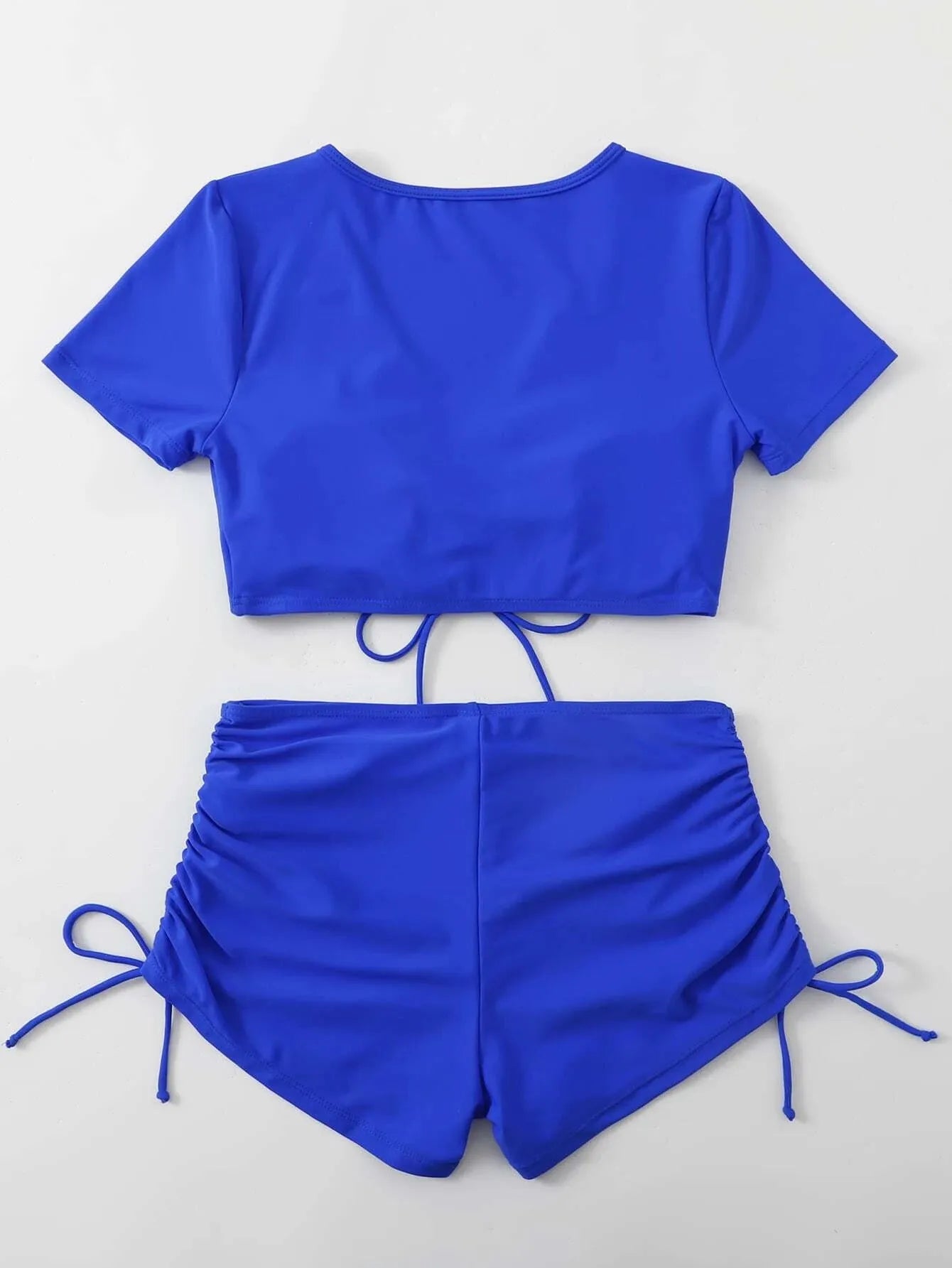 Women's lace-up bow swimsuit with shorts in polyester fibre, shown in available colours