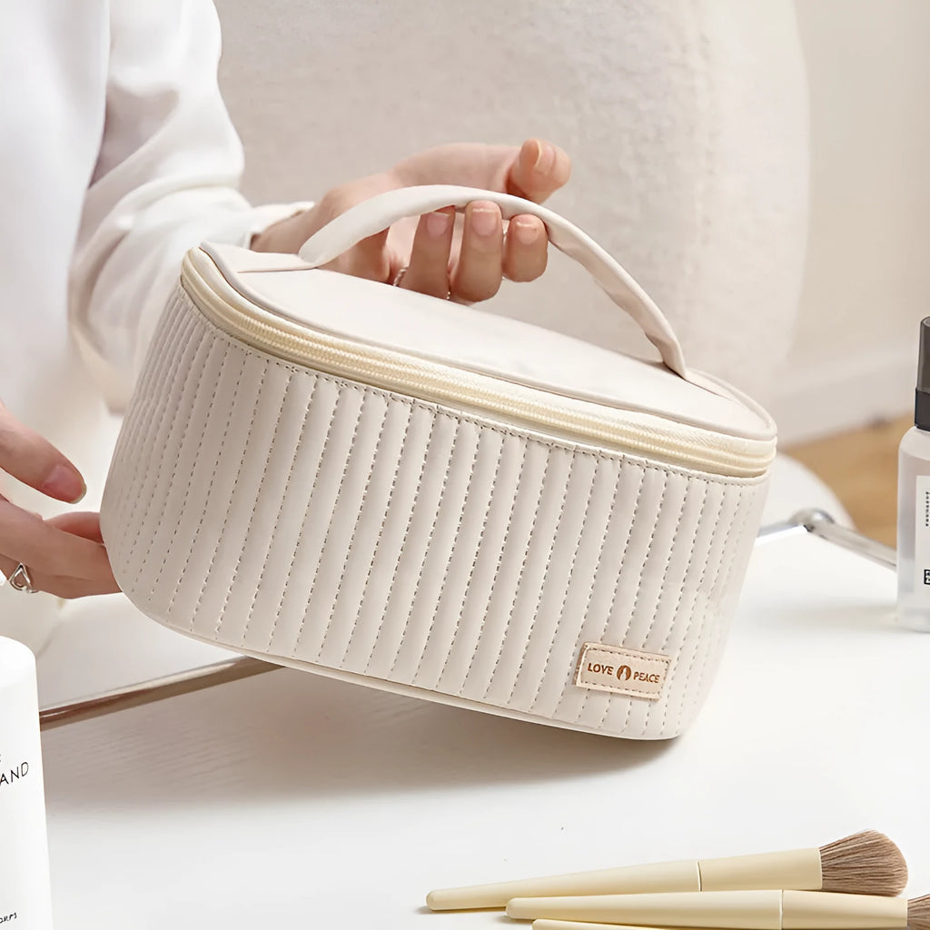 Open-top cake style makeup bag in soft PU leather, shown in one of six solid colour options.