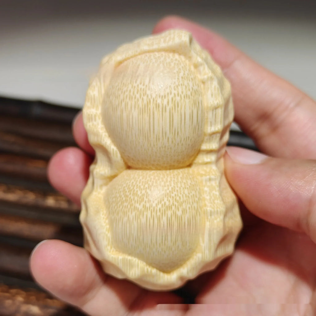 Hand-carved solid bamboo peanut ornament in modern simple style