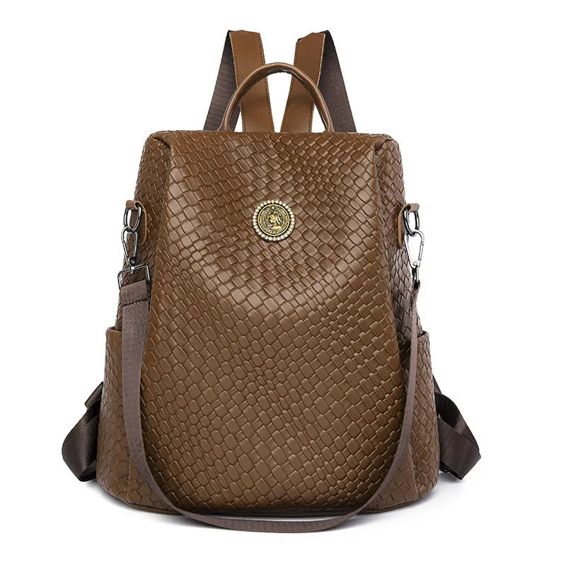Women's black anti-theft backpack with weaving detail and organisational compartments