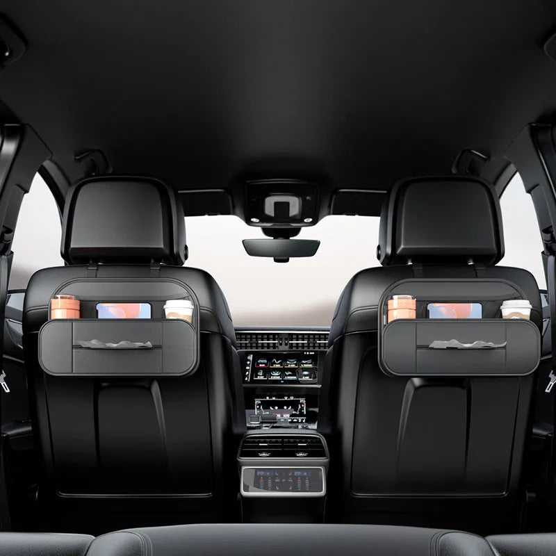 Black leather car seat back storage bag with mesh pockets for phones and bottles.