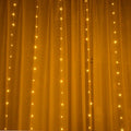 Copper curtain fairy lights with multiple LEDs in blue, purple, and white colours for indoor outdoor Christmas decoration