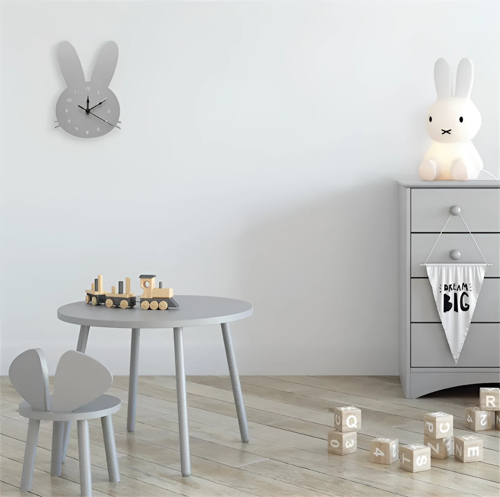 Colourful wooden cartoon wall clock featuring a playful alien design, showing battery compartment on back.