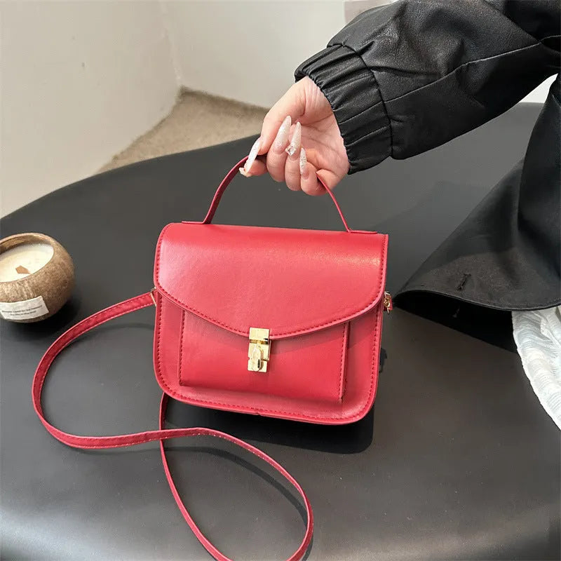 PU leather messenger bag in horizontal square shape with crossbody strap and document compartment