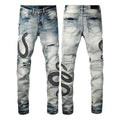 Close-up of vintage blue wash distressed skinny jeans with a tapered leg and button fly.