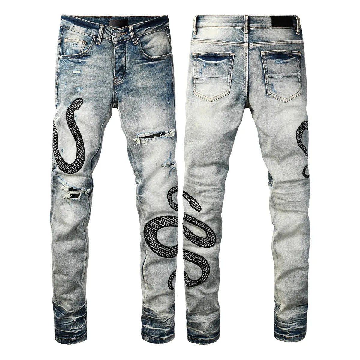 Close-up of vintage blue wash distressed skinny jeans with a tapered leg and button fly.