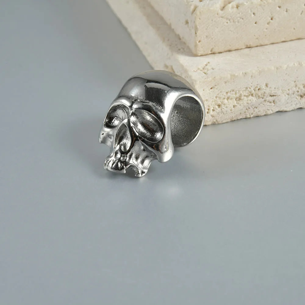 Stainless steel hollow skull Buddha earrings with electroplated colour finishes