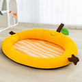 Green fruit backrest pet cushion bed for a dog, showing its nest-like shape and soft mat base.