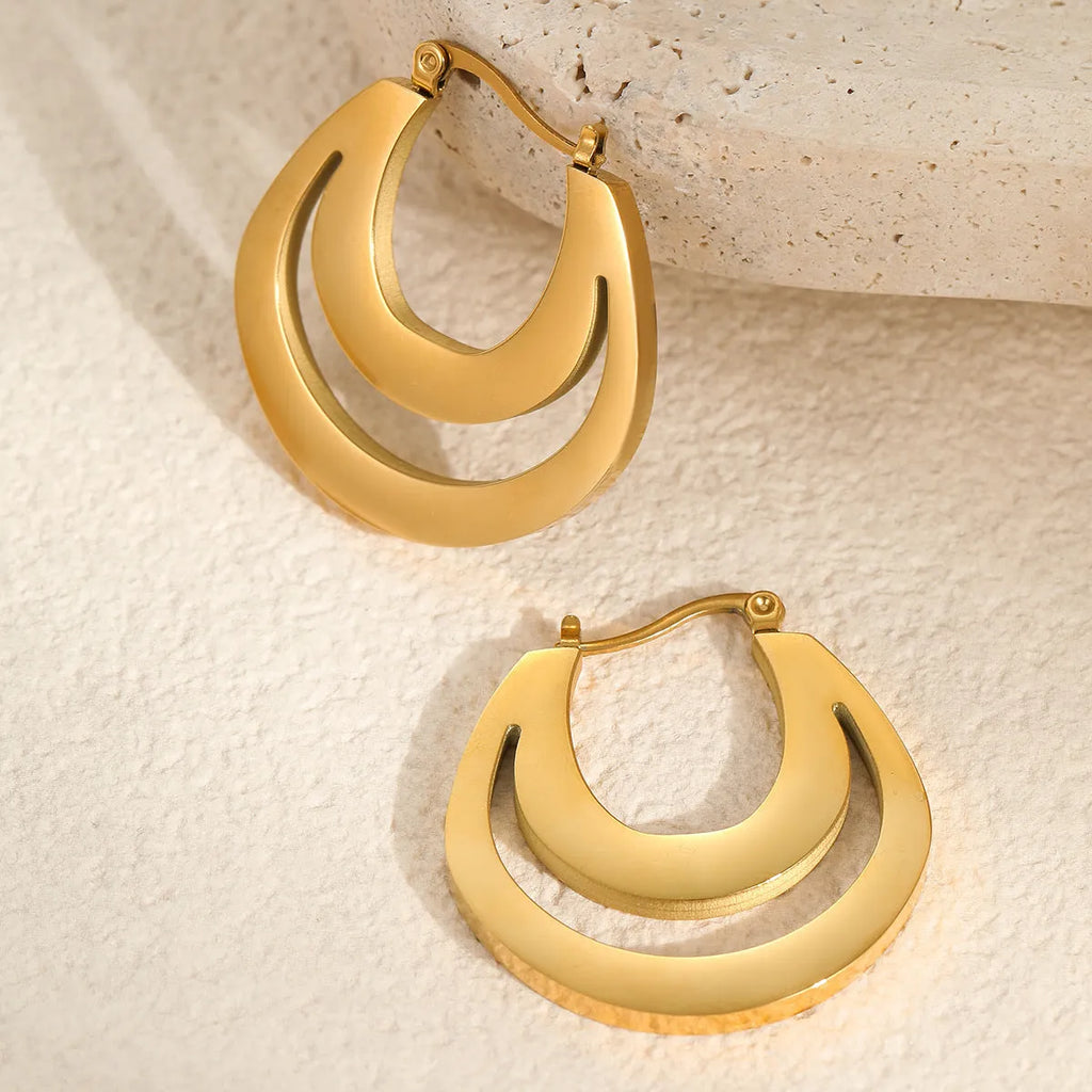 Geometric gold plated French earrings with round ring elements on stainless steel