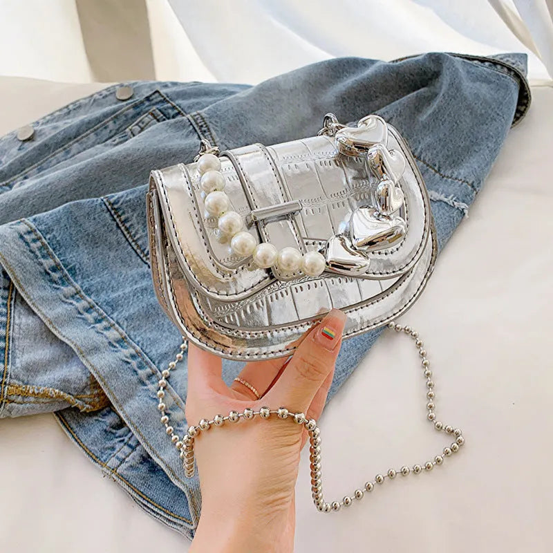 Women's mini saddle crossbody bag in horizontal square design with single shoulder strap