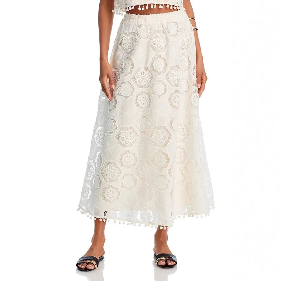 White women's retro art suit with sleeveless top and long skirt featuring embroidery details