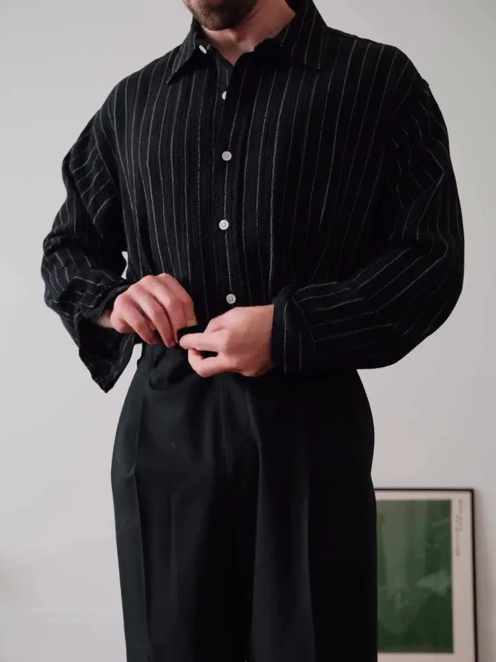 Man's black and white pinstriped long sleeve formal button-down shirt