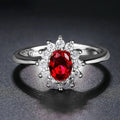Copper electroplated women's ring with floral zirconium centre stone in blue, green, or red