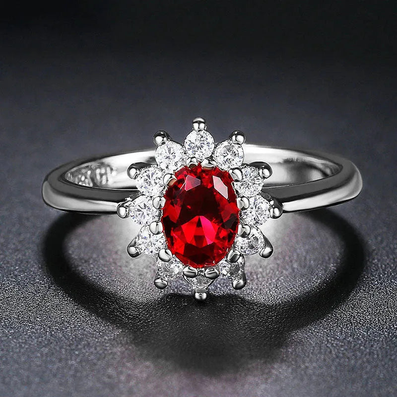 Copper electroplated women's ring with floral zirconium centre stone in blue, green, or red