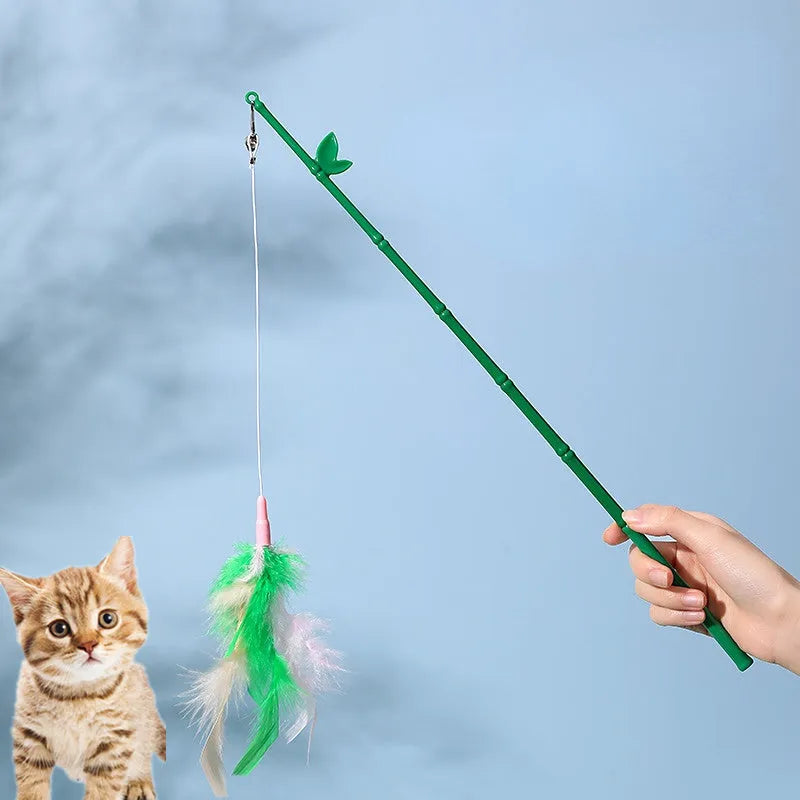 Green interactive cat wand toy with feathers and a bell on a durable plastic handle.