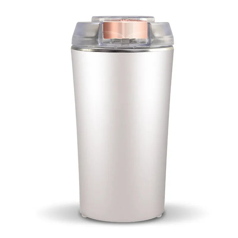 Blue mini flour mill grinder with stainless steel mechanism for grinding spices and grains.