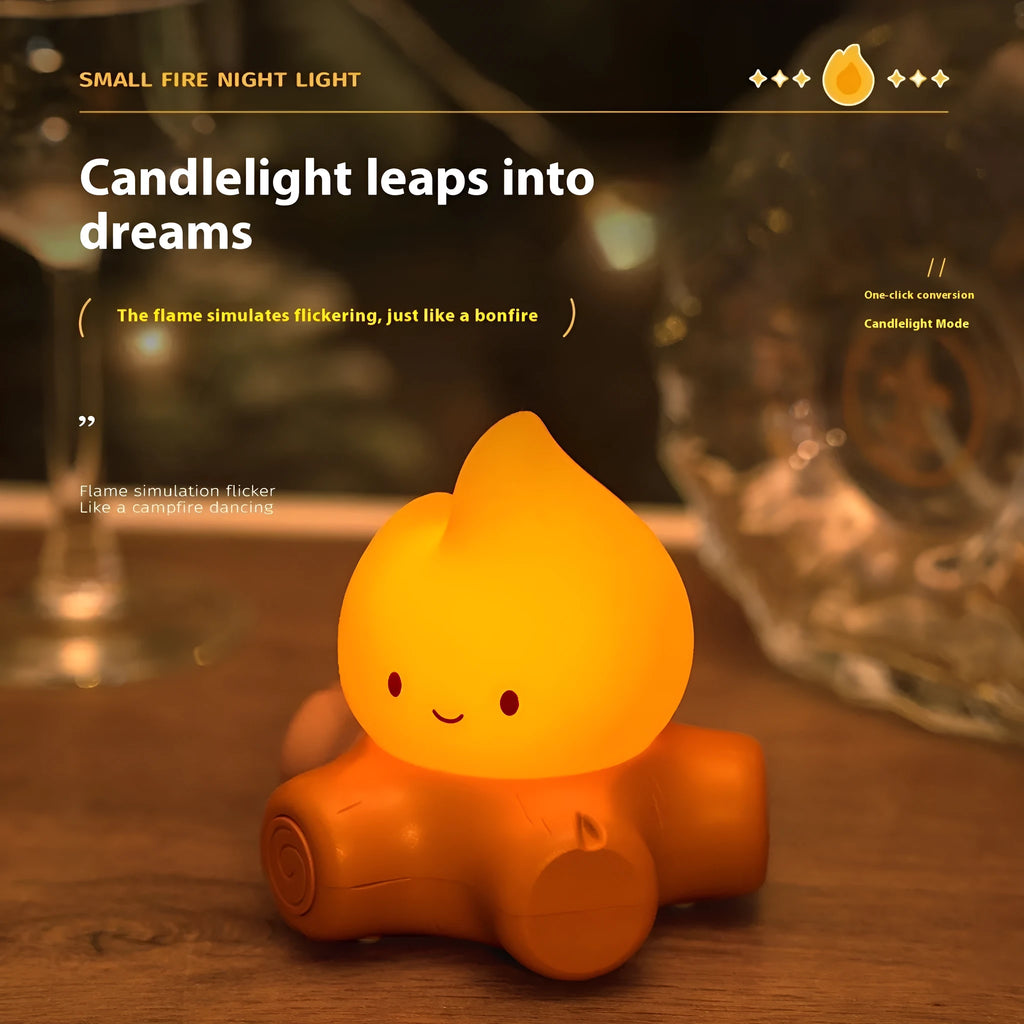 Silicone small fire pile shaped cartoon night light with yellow glow on a surface.