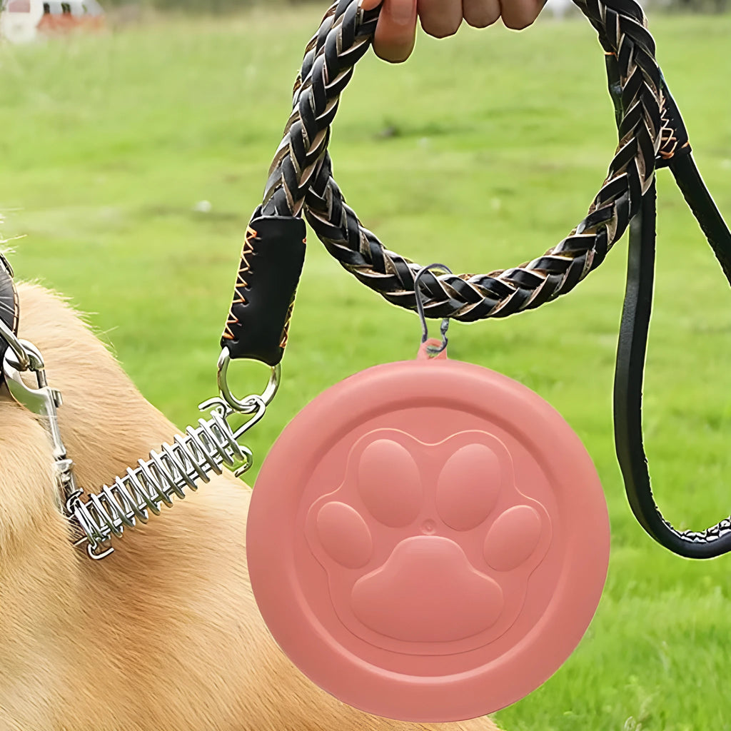 Portable dog food and water bowl with snack storage compartment in light pink colour