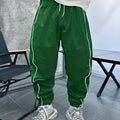 Man wearing blue loose-fit cropped sports trousers made from bamboo fibre.
