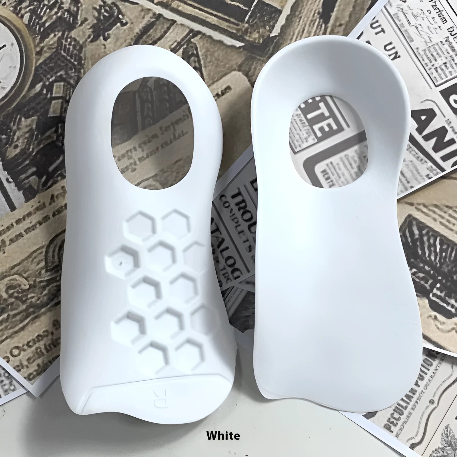 TPR arch support varus correction insoles in white, black, and skin colour showing size ranges 35-39 and 40-45.