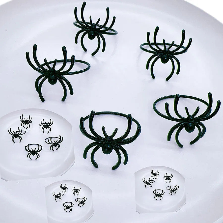 Six black spider alloy napkin rings for Halloween table decorations measuring 5x4.5x4cm