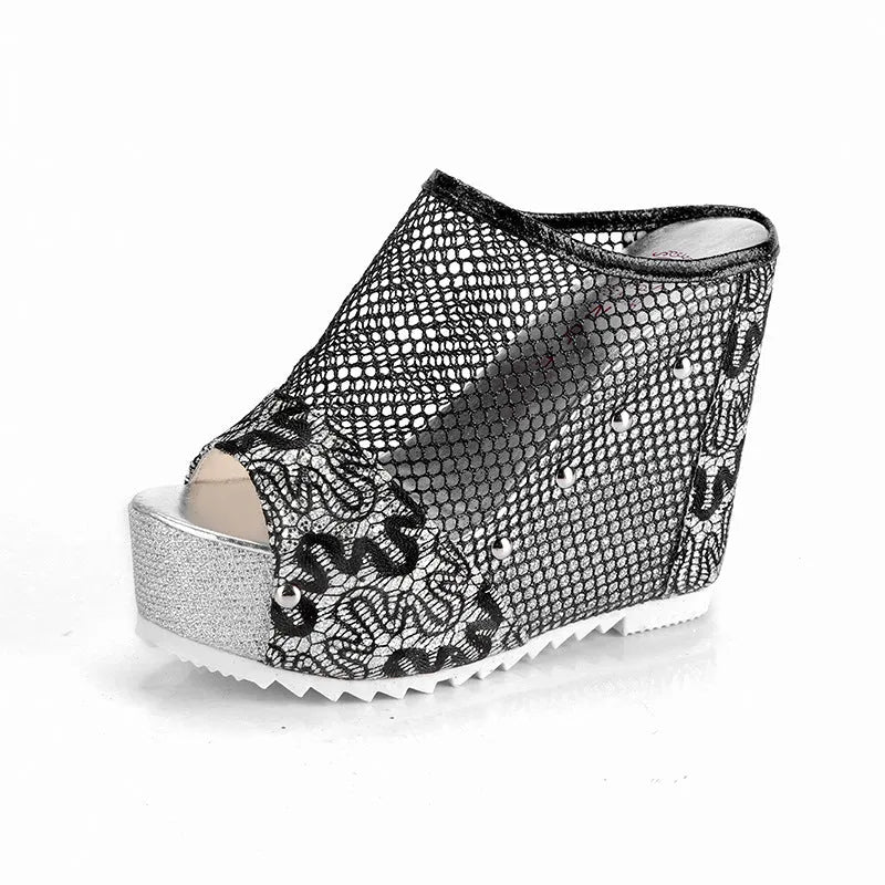 Women's black mesh flip flops with a chunky platform sole featuring a hollowed-out heel design.