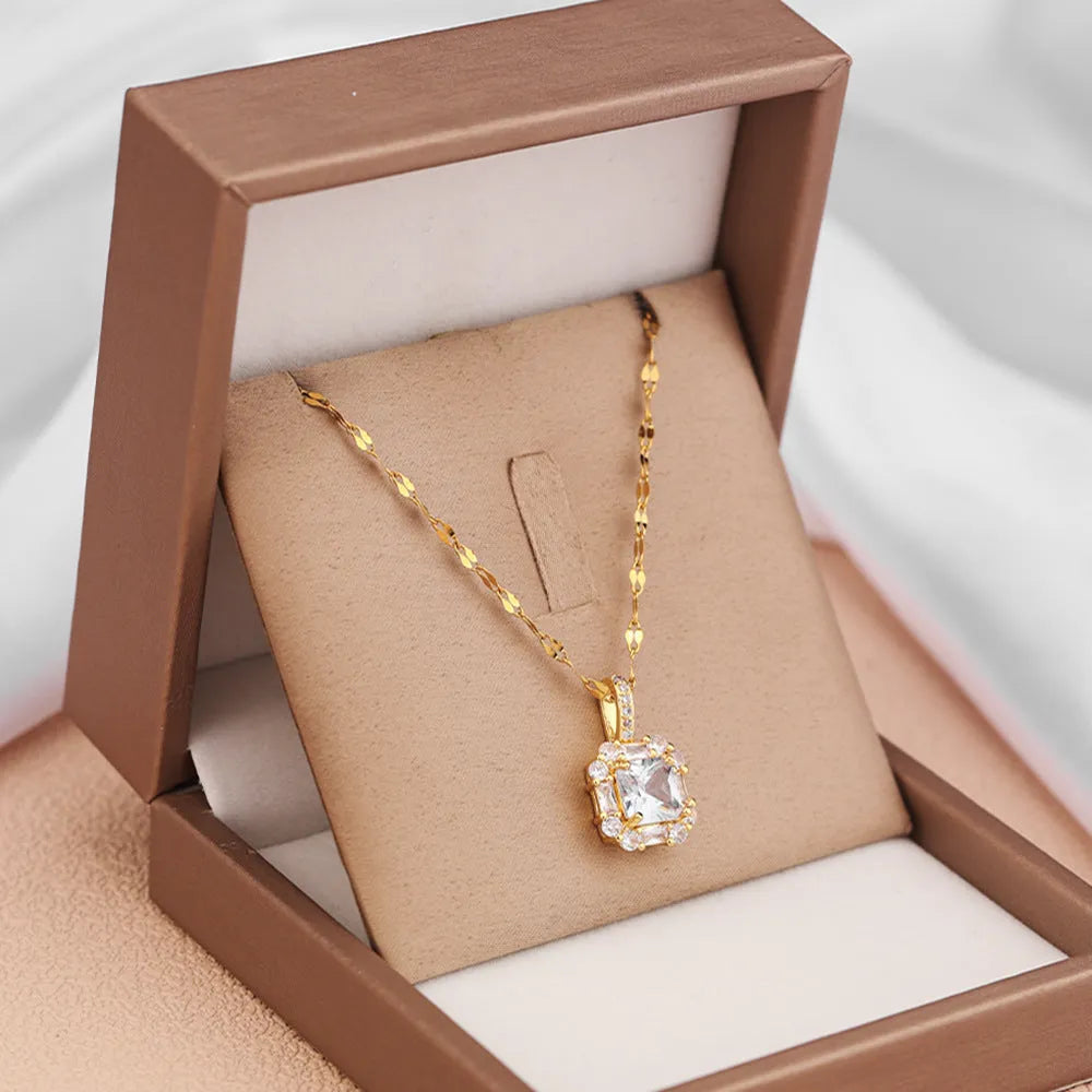 Women's geometric clavicle chain with quadrilateral pendant containing mixed gem inlays on water wave titanium steel chain