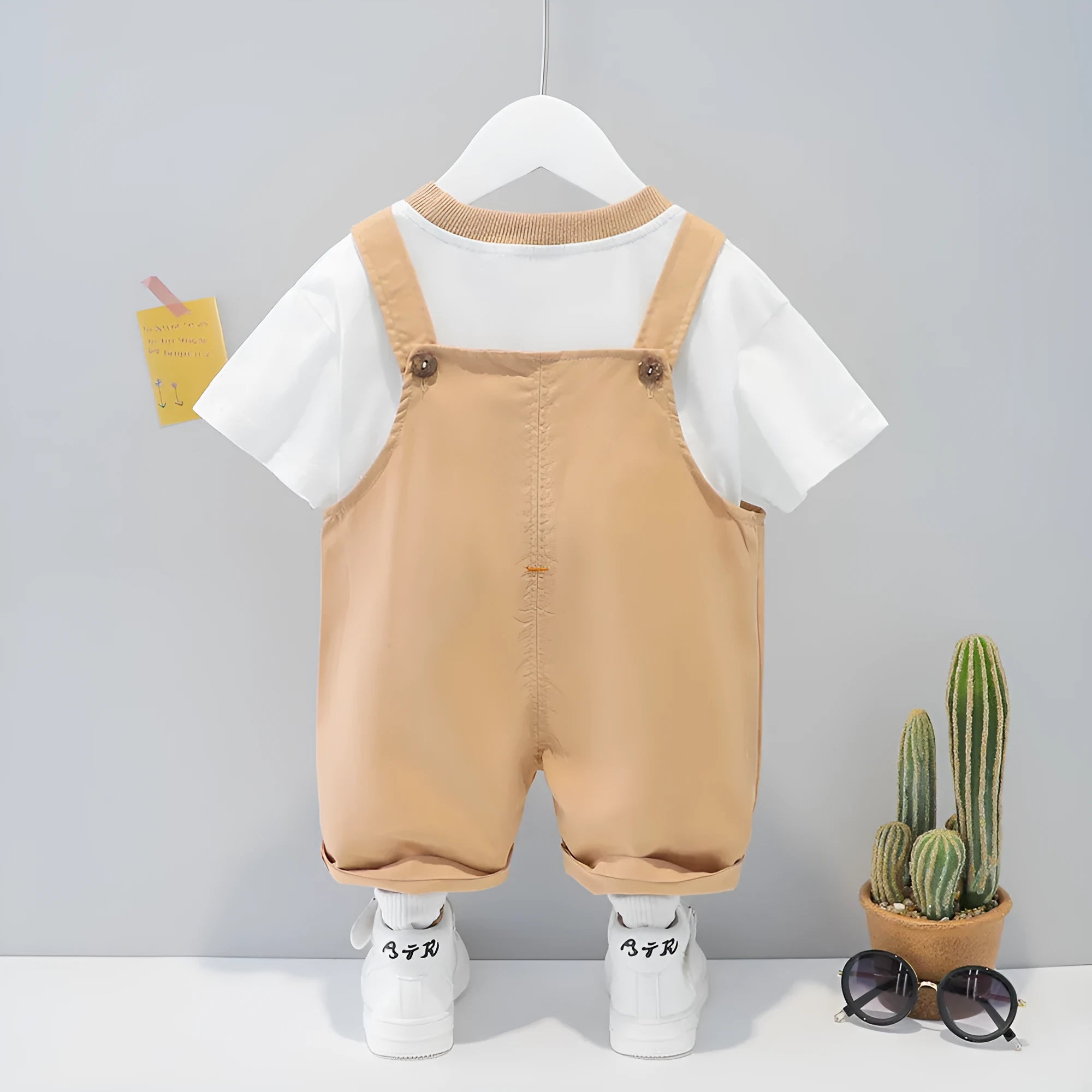 Yellow cotton baby short-sleeved overalls with cartoon print and adjustable straps