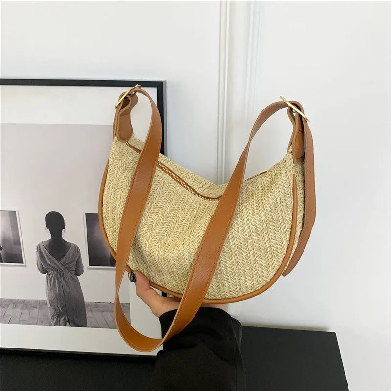 Women's woven straw crossbody bag with single strap and internal phone pocket