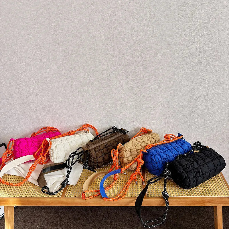Women's lightweight nylon pillow-shaped messenger bag with a crossbody strap in six colour options.