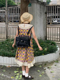 Black oil wax leather-style messenger bag for women with 35cm length and shoulder strap