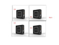 Black and white Super QI wireless charging power bank with built-in plug and international adapters.