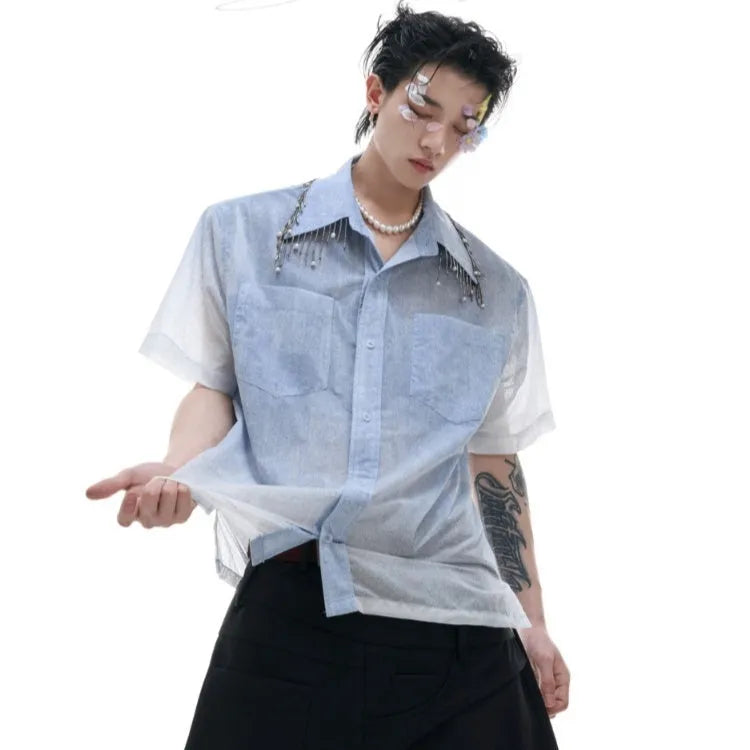 Man wearing a loose-fit gradient blue short-sleeved polyester casual shirt.