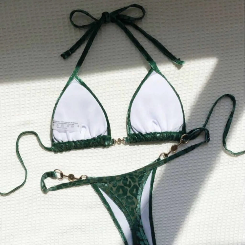 Blue leopard print women's polyester bikini set on a yellow background, showing a T-shaped sleeveless design.