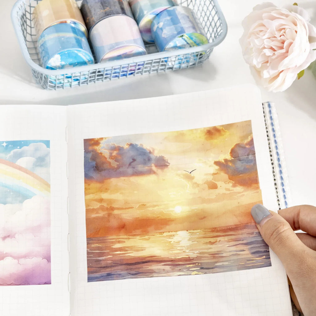 Japanese paper washi tape roll with celestial sky designs including twilight and colourful clouds patterns