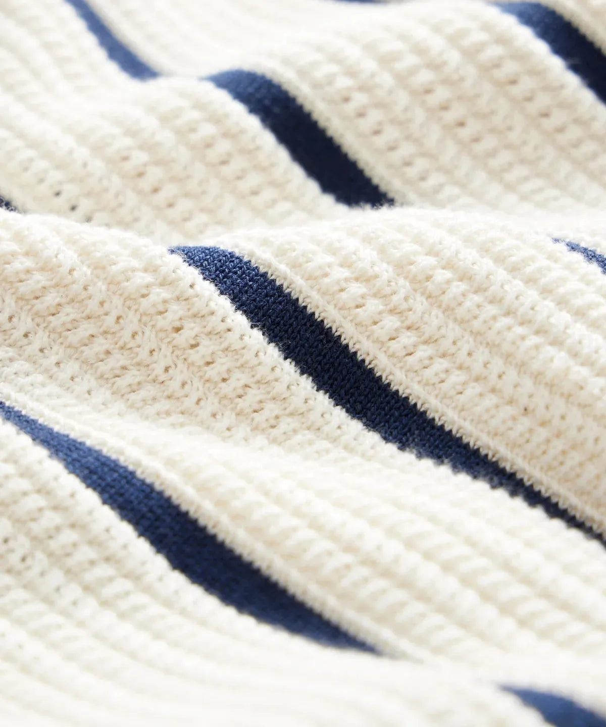 Men's white knitted short sleeve top with a lapel collar and asymmetric British style design