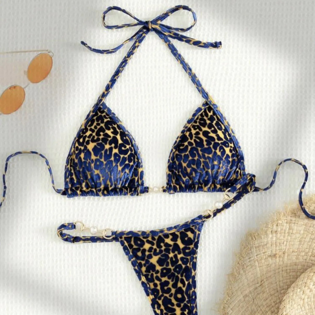 Blue leopard print women's polyester bikini set on a yellow background, showing a T-shaped sleeveless design.