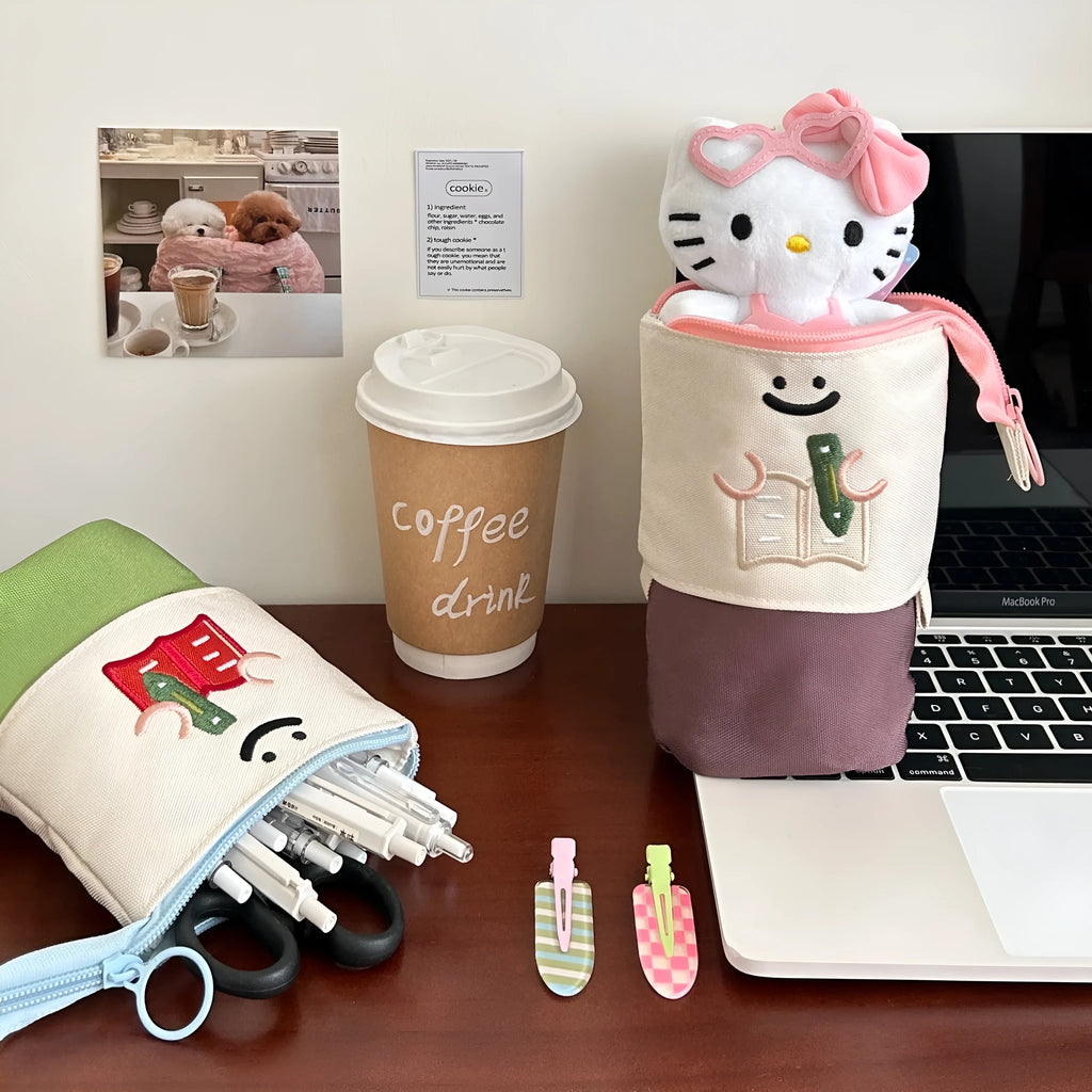 Brown Korean style cartoon print collapsible pencil case with zipper, lying flat.
