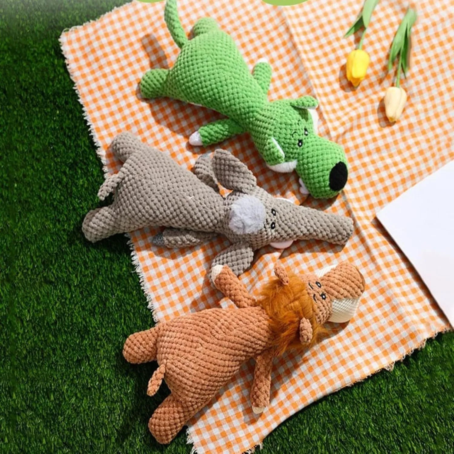 Plush dog grinding teeth toy with corn kernel texture in green, grey or yellow with squeaker